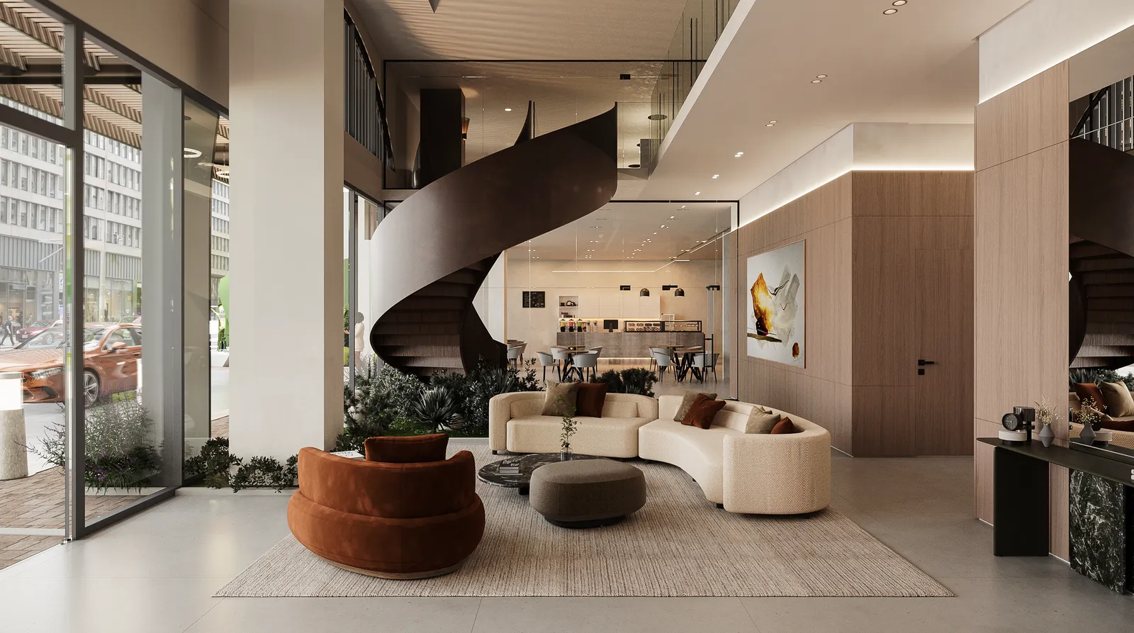 Lobby de doble altura con escalera de caracol y áreas de espera.