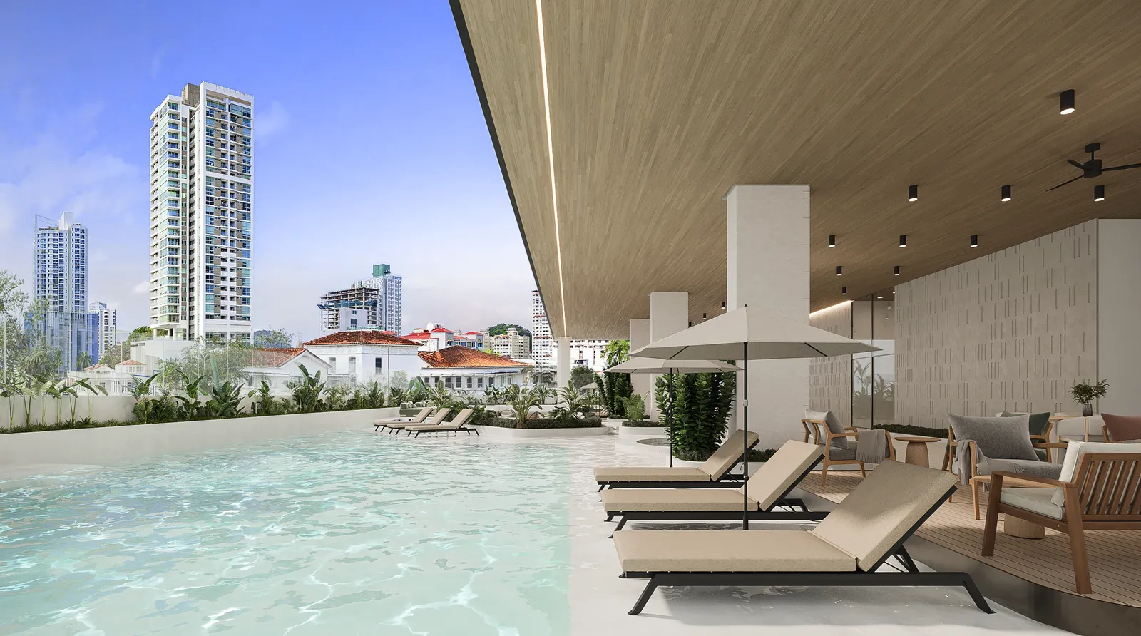 Piscina en altura con tumbonas y vistas panorámicas de la ciudad.